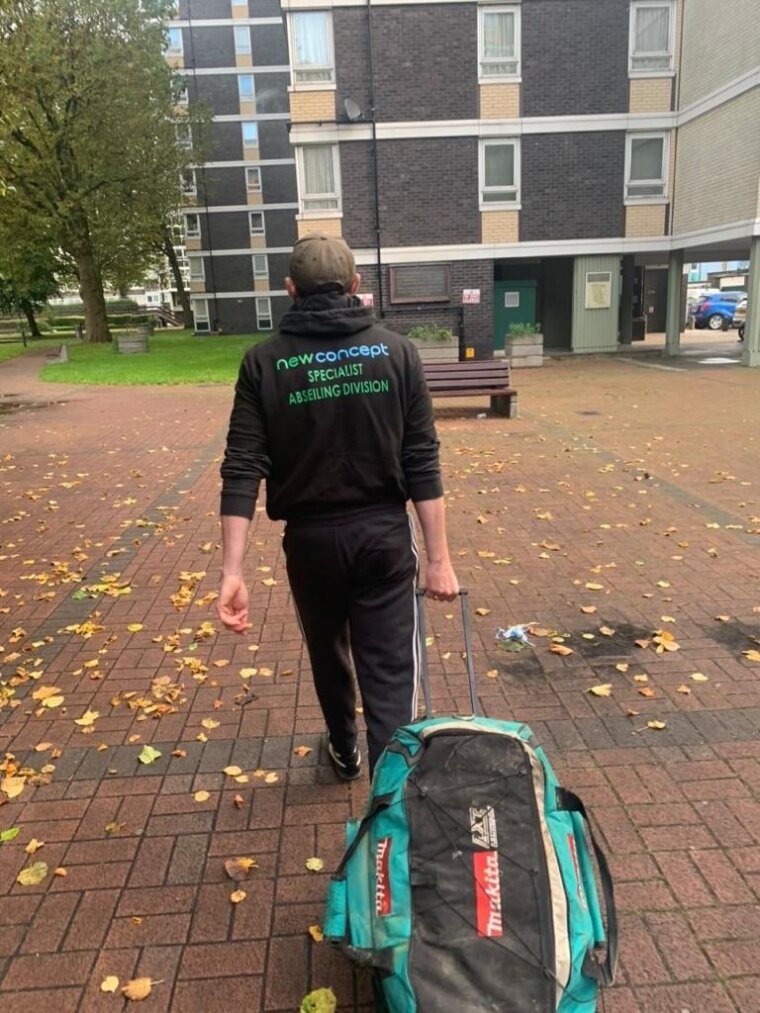 Picture of man walking towards a building